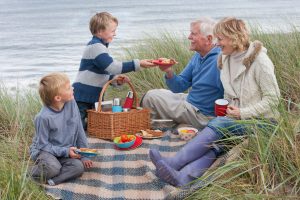 Grandparents having a picnic with grandchldren